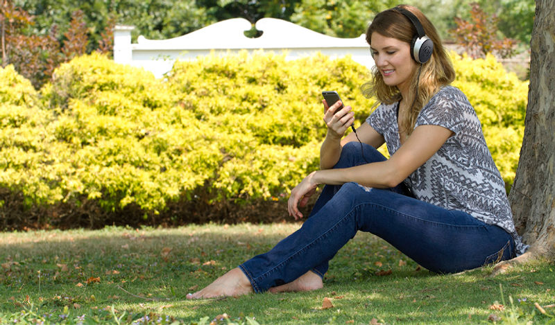 Female Outdoors with SR550 headphones